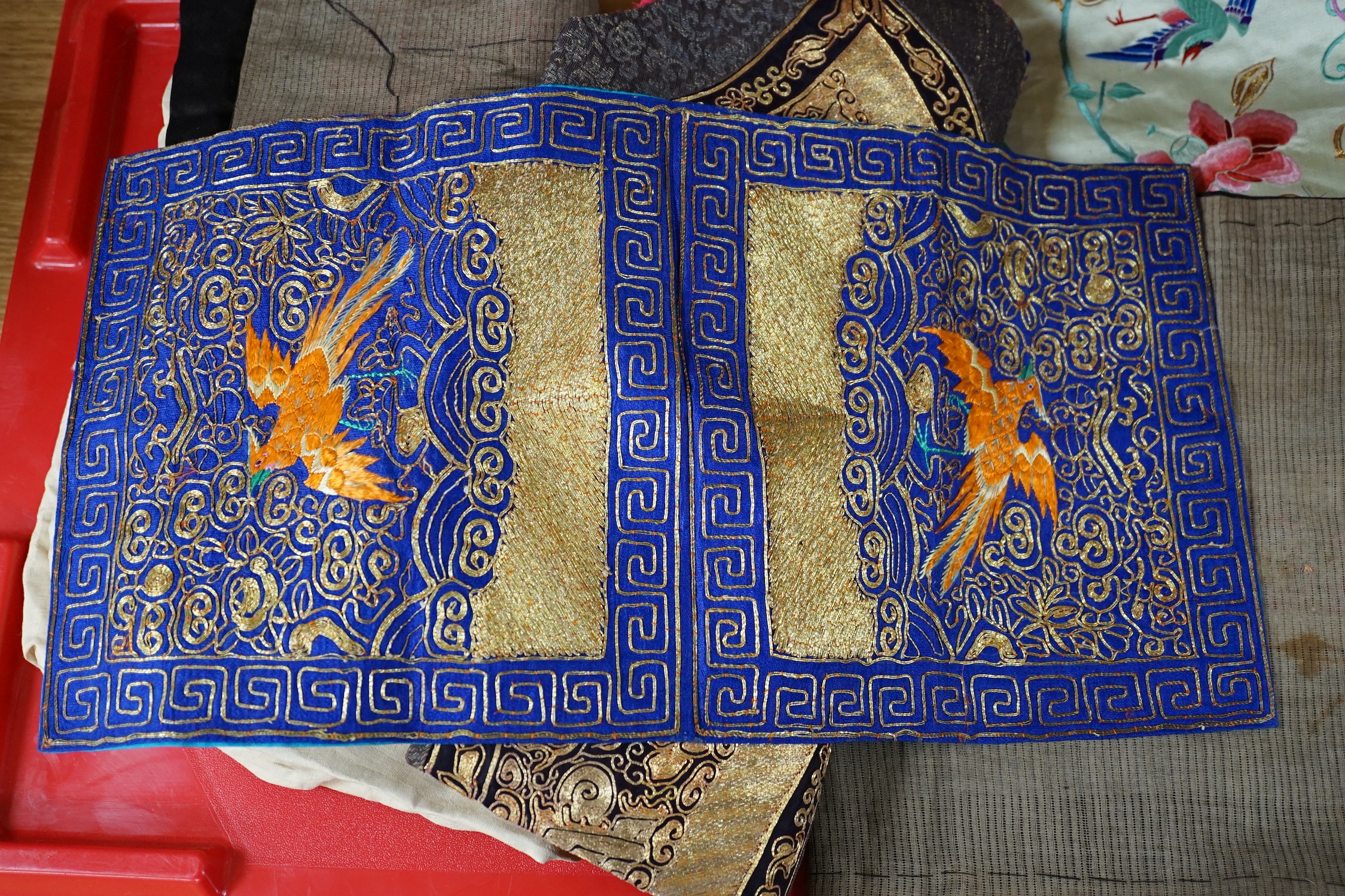 Two mid 20th century Chinese embroidered Rank Badges, a large gold thread dragon embroidered collar, three Chinese embroidered panels and a Japanese 1930’s Shantung silk dragon embroidered Kimono dressing gown